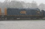 CSX Business train in pouring rain